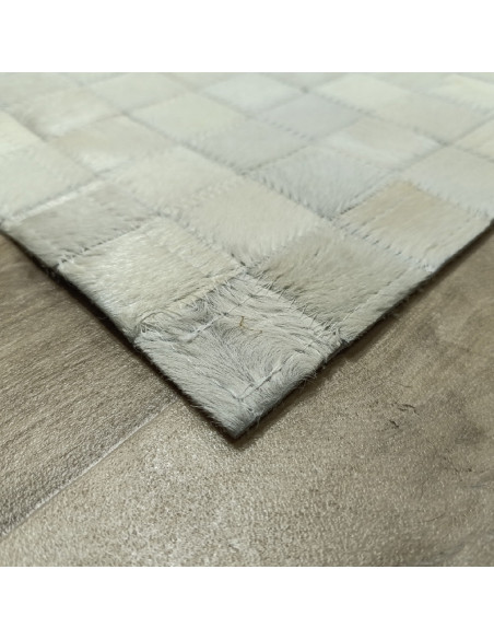 Patchwork white leather rug, at alfombrasimperio1979.com.